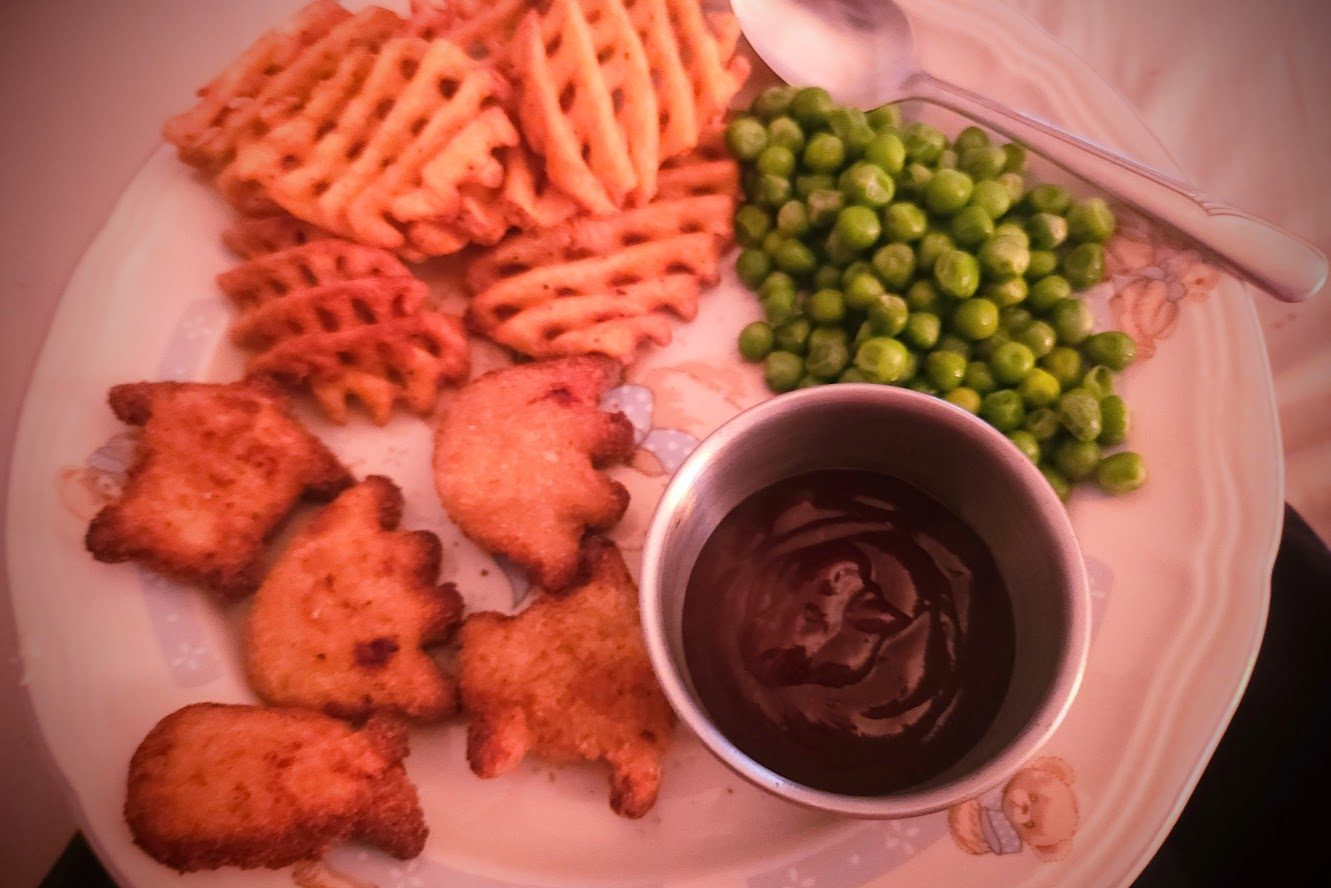 plate of nuggets and peas